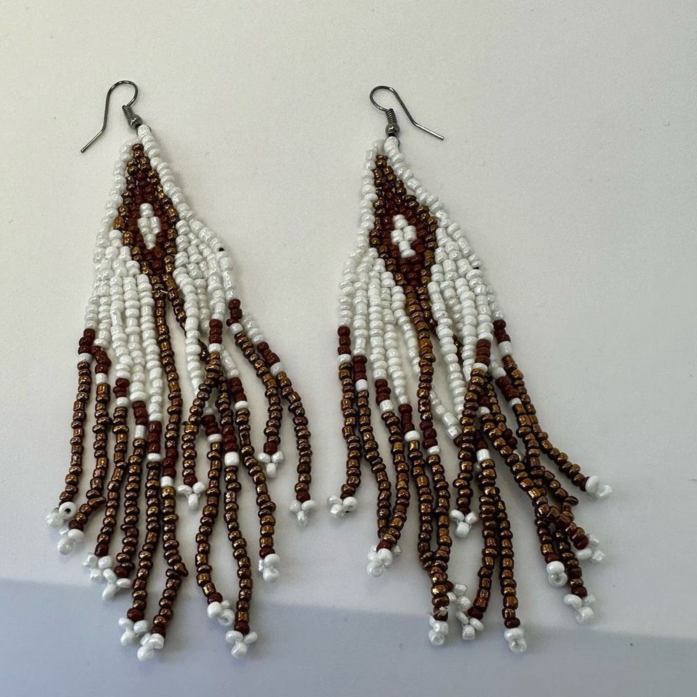 Brown and white beaded long earrings